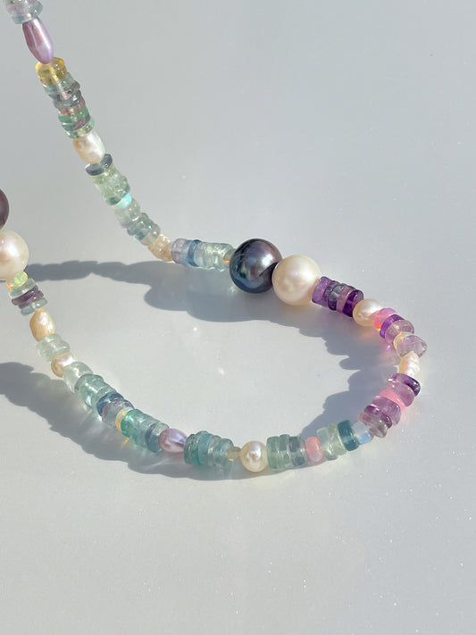 Nāmaka Bold Fluorite with Akoya &amp; Tahitian Pearl Choker Necklace.&nbsp;Each fluorite gem disk, unique in colour and pattern, with pastel hues of all colours of mint, juniper and amethyst. Highlighted by Estate re-purposed Tahitian Black Pearls &amp; Akoya Pearls, asymmetrically placed around the neckline. A scattering of freshwater pearls and Ethiopian Opals highlight the piece. Finished with Sterling Silver hardwear. This necklace is both casual yet elegant. Designed &amp; handcrafted by Nāmaka in Melb