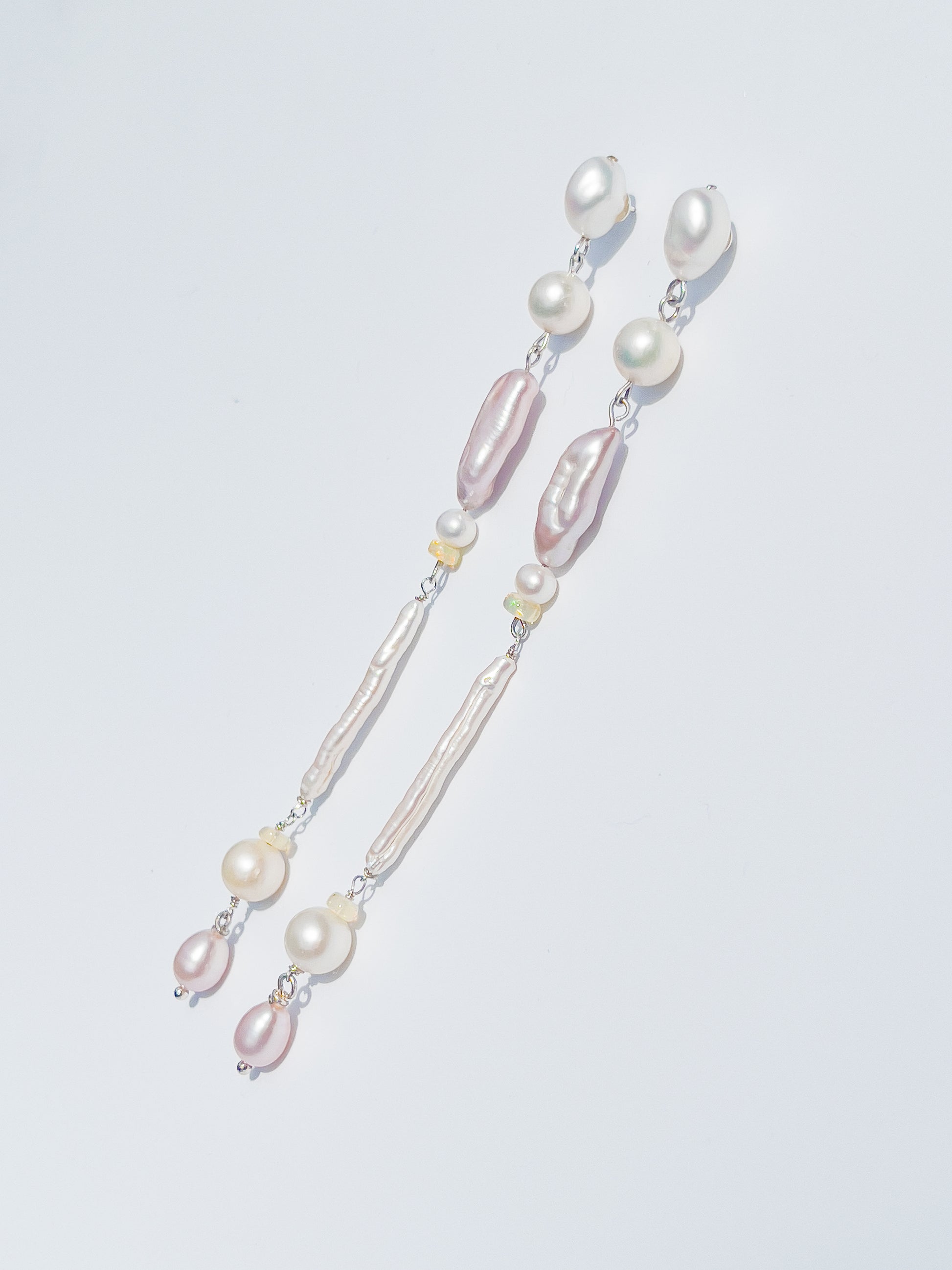 Candy Pearl & Opal Drop Earrings - These earrings are an absolute showstopper. Hand crafted using Sterling Silver, which suspend a combination of Violet Keshi Pearls, South Sea Pearls, Opals, Biwa Pearls, Freshwater Pearls and Luxe Violet teardrop pearls. These earrings glisten in candy colours, and are uniquely gorgeous in every way.