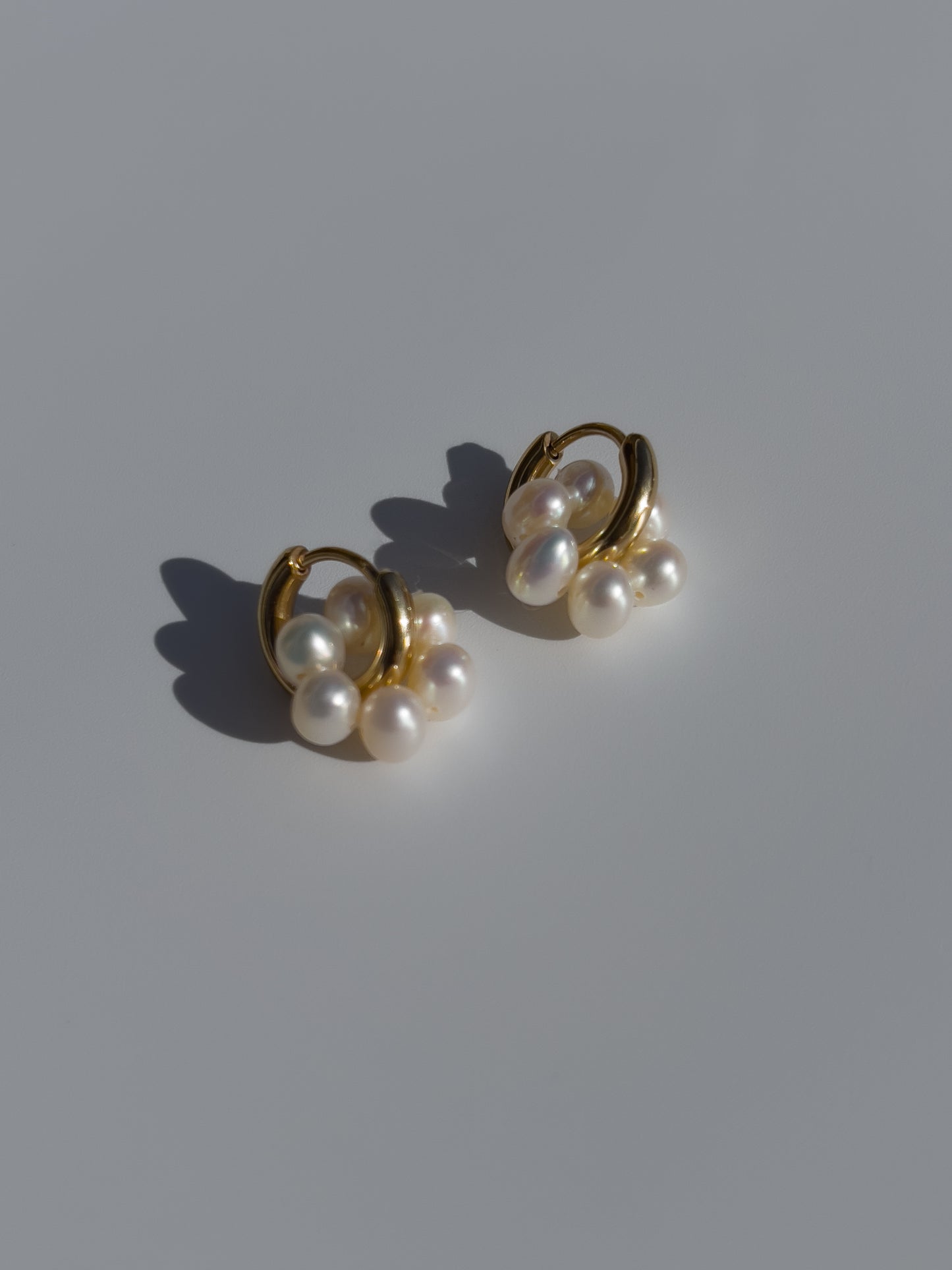 Pearl Halo Hoops - 14 karat Gold Filled Hoops, each suspending a halo of freshwater pearls. This ultra cute pair, can be worn singularly, or combined with other pieces.y